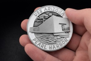 USS Arizona Memorial challenge coin – held in hand
